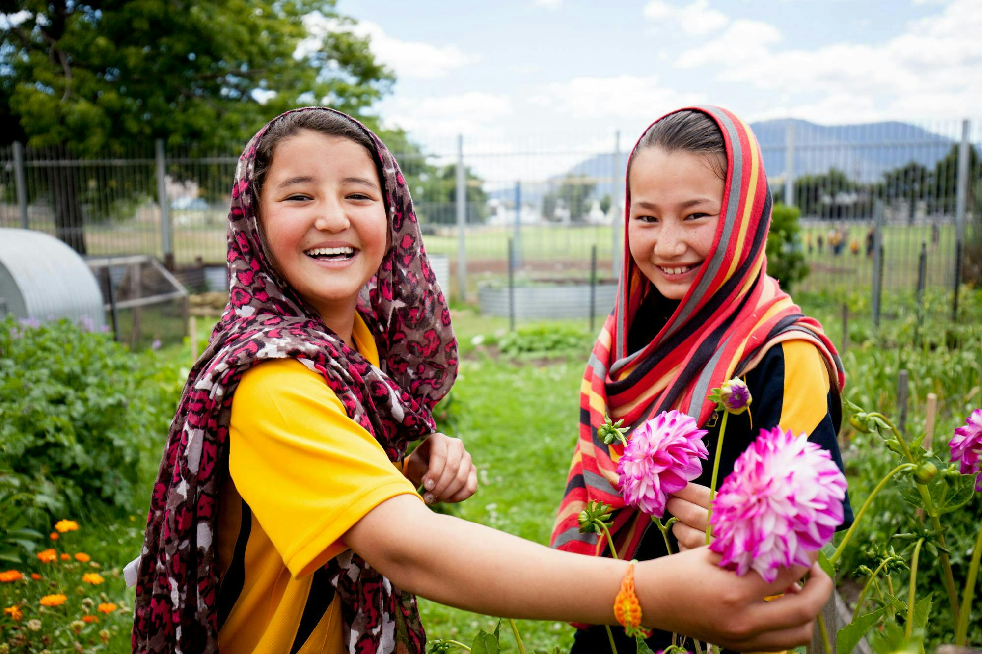 Students at Glenorchy Primary School in  the garden picking flowers 2014